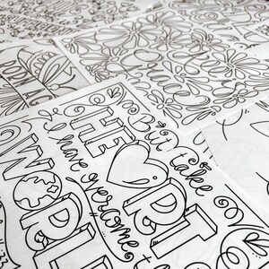 May include: A collection of black and white line art prints. The prints feature floral patterns and inspirational quotes, including the words "Born Again" and "The Best is Yet to Come". The designs are suitable for coloring.