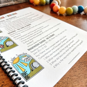 May include: A printable worksheet with a colorful illustration of a sun rising over a stone tomb. The worksheet is titled "Easter Sunday - He is Risen!" and includes comprehension questions about the resurrection of Jesus.