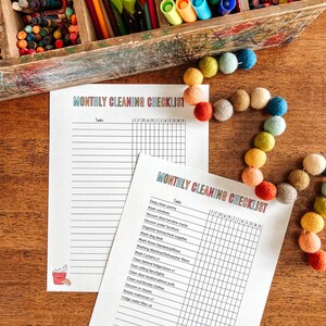 May include: A printable monthly cleaning checklist with a grid for each day of the month. The checklist includes tasks such as deep clean pantry, wash windows, vacuum door/window tracks, vacuum under furniture, organize homeschool supplies, wash dog beds, wash throw blankets/pillows, washing machine/dishwasher filters, wash curtains, clean behind fridge/stove, dust ceiling fans/lights, clean door knobs/cabinet pulls, clean out/donate clothes, vacuum in closets, rotate mattresses, and fridge water filter.