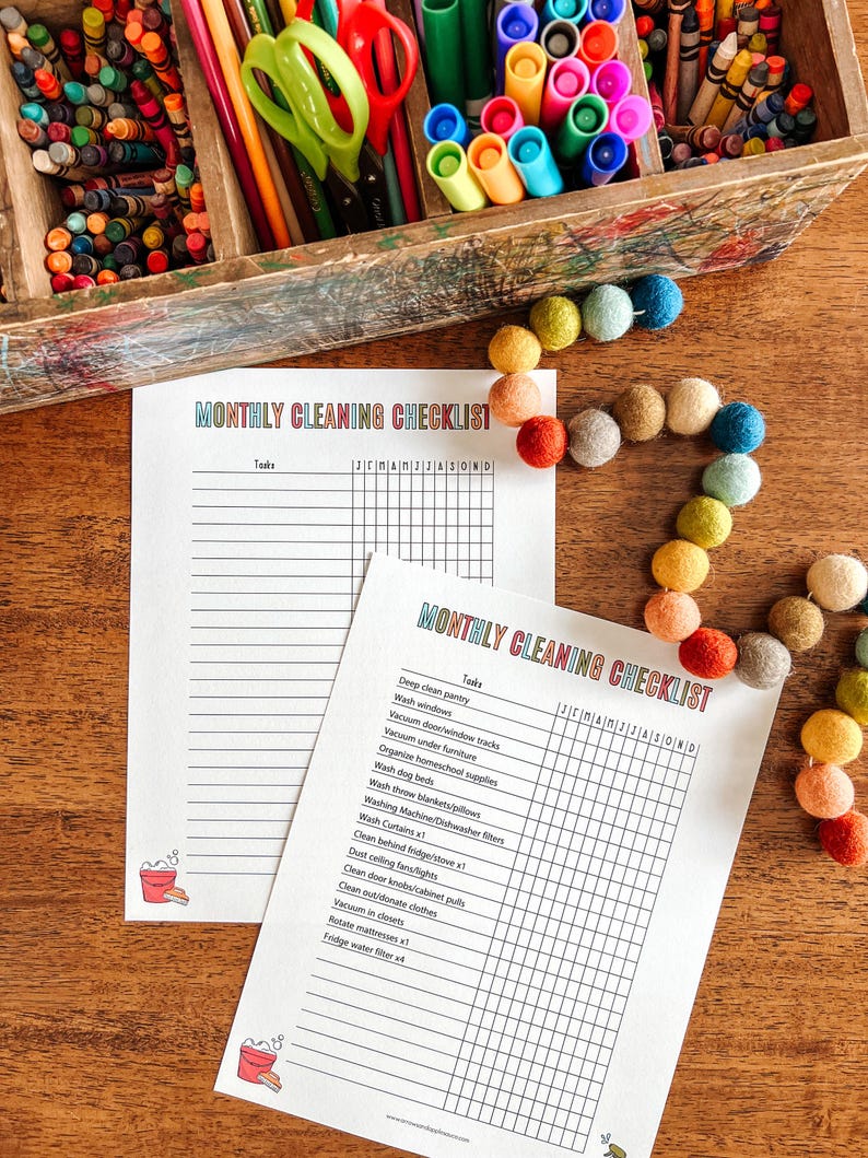 May include: A printable monthly cleaning checklist with a grid for each day of the month. The checklist includes tasks such as deep clean pantry, wash windows, vacuum door/window tracks, vacuum under furniture, organize homeschool supplies, wash dog beds, wash throw blankets/pillows, washing machine/dishwasher filters, wash curtains, clean behind fridge/stove, dust ceiling fans/lights, clean door knobs/cabinet pulls, clean out/donate clothes, vacuum in closets, rotate mattresses, and fridge water filter.