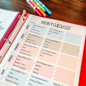 May include: A weekly checklist for kids with a pink and blue color scheme. The checklist includes daily tasks such as math, reading, narration/journal, responsibilities chart, first language lessons, spelling, typing, sewing, writing & rhetoric, and piano.