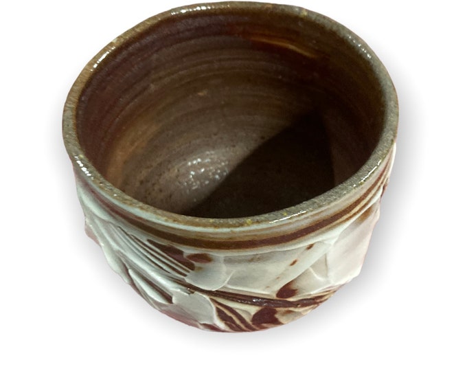 Small wood fired cup.  Porcelain slip decoration. Free shipping within Australia.