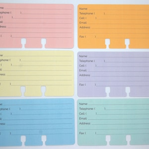 May include: Six rectangular contact information cards in pastel pink, orange, yellow, purple, blue, and green. Each card features printed lines and labels for Name, Telephone, Cell, Email, Address, and Fax, with two cutouts along the bottom edge.