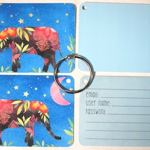 May include: Two blue cards with a watercolor illustration of an elephant with a pink crescent moon and gold stars. The cards are attached to a blue card with the text "email: user name: password:" and a blue card with alphabetical tabs.