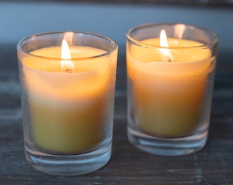 Beeswax votive candles in clear glass holders or as refills