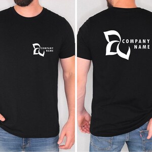 a man wearing a black t - shirt with a company name on it