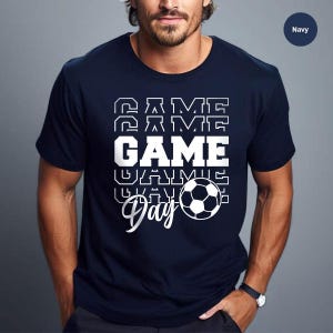 a man wearing a t - shirt with a game on it