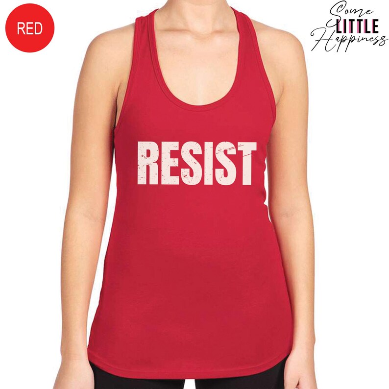 May include: Red tank top with the word "RESIST" printed in white on the front.