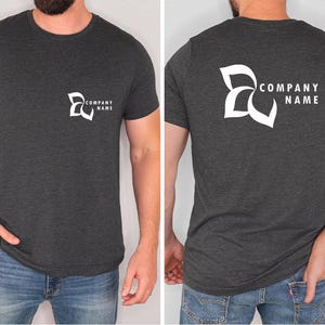 a man wearing a t - shirt with a company name on it
