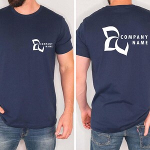 a man wearing a t - shirt with a company name on it