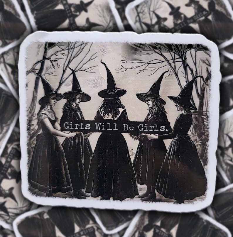 May include: A sticker with a vintage illustration of five women in witch hats and long dresses. The text "Girls Will Be Girls" is displayed across the center. The background includes bare trees, creating a spooky, gothic aesthetic.
