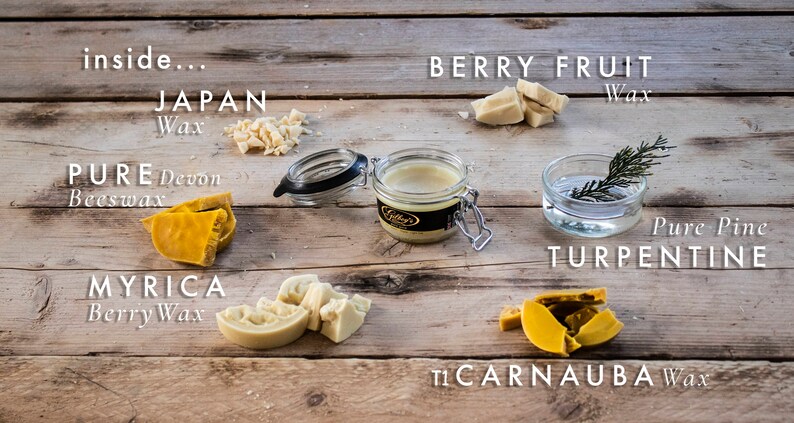 May include: A variety of natural waxes, including beeswax, carnauba wax, myrica berry wax, and Japan wax, are displayed on a wooden surface.  The waxes are in various forms, including chunks, flakes, and a jar of beeswax.