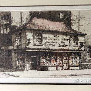May include: A black and white etching of a shop with a sign that reads "The Old Curiosity Shop immortalized by Charles Dickens".
