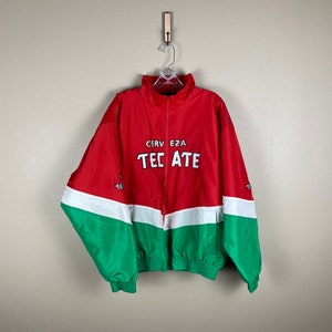May include: Red, white, and green windbreaker jacket with "Cerveza Tecate" printed on the front.