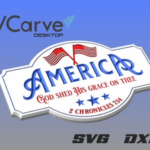May include: A white sign with a blue and red American flag design. The sign says "America" in blue cursive lettering and "God Shed His Grace On Thee 2 Chronicles 7:14" in black lettering.