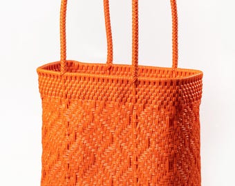 Orange Woven Plastic Tote Bag: Durable Beach Bag With Pompom