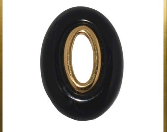 Crown Trifari • Minimalistisch zwart plastic en goud metaal abstract doorboorde ovale broche • Vintage jaren 1960
