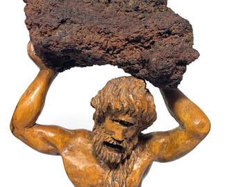 Ancient Cyclops Polyphemus statue made of wood and Etna lava stone