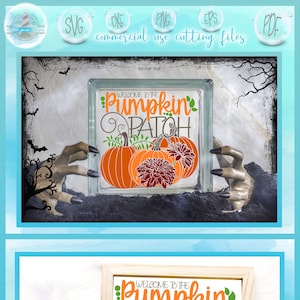 May include: Welcome to the Pumpkin Patch sign with two orange pumpkins and a burgundy flower. The sign is in a wooden frame and is sitting on a white surface.