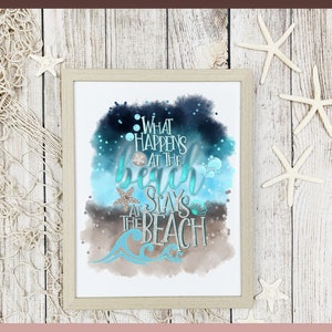 May include: A watercolor print with a blue, brown, and white background. The text reads "What happens at the beach stays at the beach".