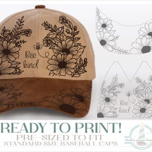 May include: A tan baseball cap featuring a dark brown brim and a black line-art floral design with a small bee and the text Bee kind. To the right, a digital template shows the same floral pattern, bee, and text on a white background.