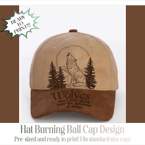 May include: A tan and brown baseball cap featuring a dark brown graphic of a wolf howling at a full moon surrounded by pine trees. The text on the brim reads: Wolves don't lose sleep over the opinions of sheep. A green starburst graphic says READY TO PRINT.