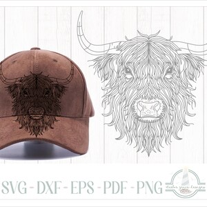May include: A brown baseball cap with a black and white line drawing of a Highland cow's head on the front.
