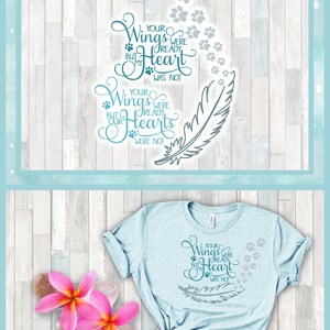 May include: A light blue t-shirt featuring a dark teal graphic design with a feather, paw prints, and the text: Your wings were ready but my heart was not. Your wings were ready but our hearts were not. The shirt is displayed with two pink flowers.