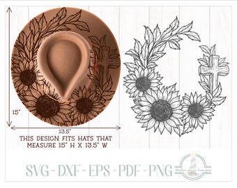 May include: A tan fedora hat featuring a black line art design of sunflowers and a wooden cross. The design is also shown separately as a black and white graphic. Text indicates the design fits hats measuring 15 inches high by 13.5 inches wide.