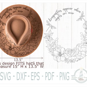 May include: A tan felt hat featuring a black line art design of flowers, leaves, and dragonflies with the text "dragonflies appear when angels are near". The design measures 15 inches high by 13.5 inches wide, shown as a digital file format.