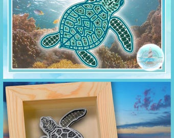 May include: A digital design file featuring a teal and green layered sea turtle illustration with intricate geometric patterns, alongside a physical example of the turtle cut-out displayed inside a light-colored wooden shadow box frame.