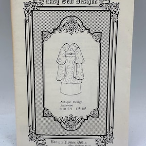 May include: A black and white illustration of a doll wearing a traditional Japanese kimono with a floral pattern. The illustration is on a white background with a black border. The text "BHD 671 17"-18" Easy Sew Designs Antique Design Japanese BHD 671 17"-18" Brown House Dolls Allen, Michigan 49227 $3.50" is printed on the page.