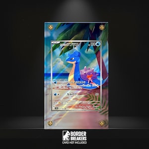 May include: A framed trading card featuring a blue and purple sea creature with a person riding on its back, set against a beach scene. The card is encased in a clear acrylic holder with gold-colored screws. The Border Breakers logo is visible at the bottom.