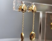 Lange oorbellen 14kt geelgoud met kiezelsteen vormen (holle uitvoering)