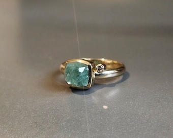 Emerald and brown diamond ring in 14kt and 18kt yellow gold.