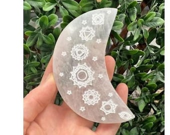 May include: White selenite crescent moon with seven chakra symbols and stars etched into the surface.