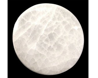 May include: A white round selenite charging plate. The plate has a smooth, polished surface with a natural, cloudy pattern.