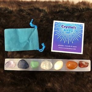 8” x 1” selenite bar chakra set, selenite charging plate, selenite ruler. Comes with 7 chakra stones and a velvet bag