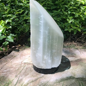 8” hand carved lipstick selenite lamp with 1” orthoceras fossil base (9” total) includes bulb and cord