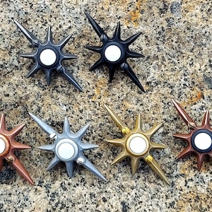 May include: A set of three ceramic vases in varying heights and shapes. The vases are glazed in a matte white finish, offering a minimalist aesthetic. The tallest vase is approximately 10 inches high.