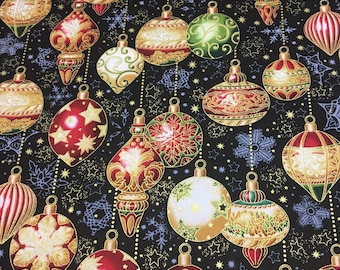 May include: A black fabric with a repeating pattern of gold, red, and green Christmas ornaments. The ornaments are decorated with gold and white swirls and have a 3D effect.