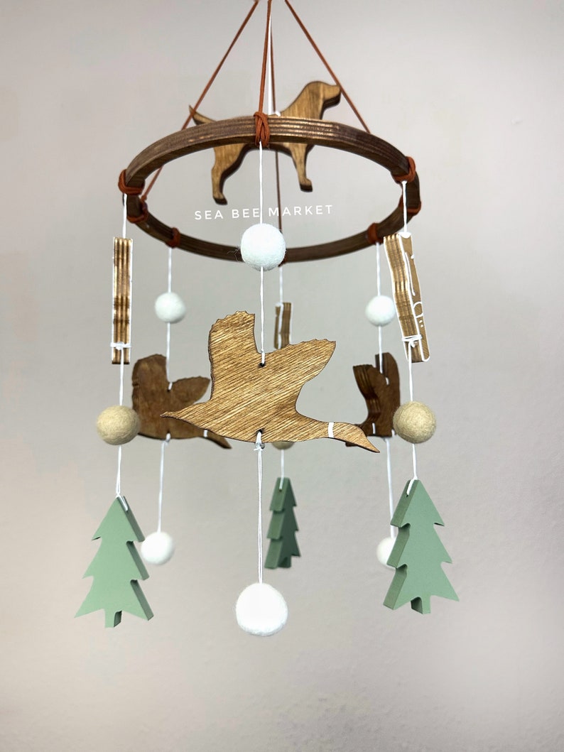 Duck Crib Mobile, Mallard Duck Calls, Green Trees, and a Hunting Dog