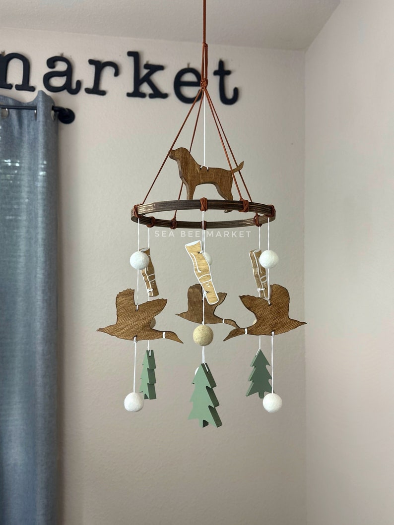 Duck Crib Mobile, Mallard Duck Calls, Green Trees, and a Hunting Dog