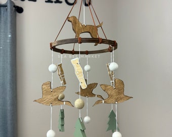 Mobiel babybedje eend: bosdecor, jachthondtopper