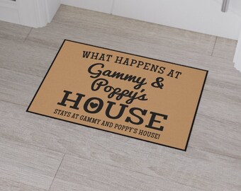 May include: A brown doormat with the text "What happens at Gammy & Poppy's House stays at Gammy and Poppy's House!" in black text with a heart symbol.