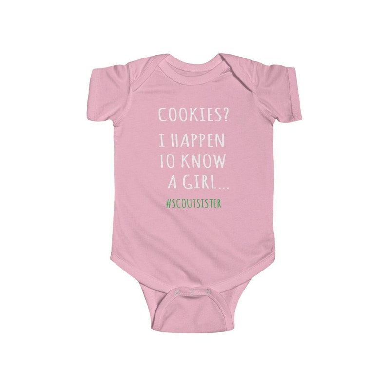 May include: Pink baby onesie with white text that reads "COOKIES? I HAPPEN TO KNOW A GIRL... #SCOUTSISTER"