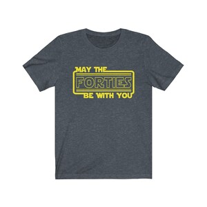 May include: A dark heather grey t-shirt with a yellow graphic that says "May the Forties Be With You".