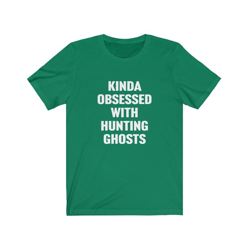 May include: A green t-shirt with white text that reads "Kinda obsessed with hunting ghosts".