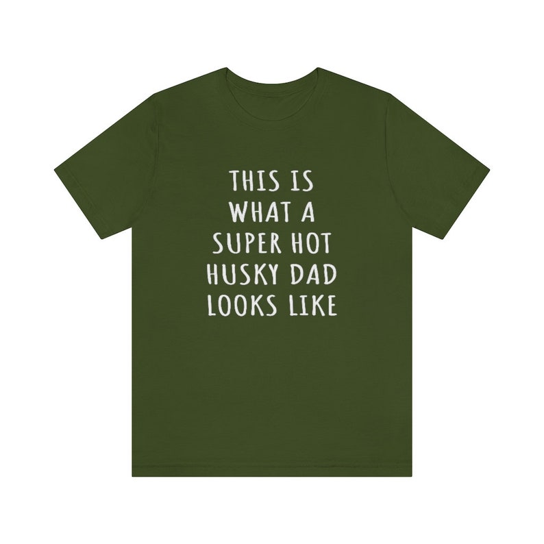 May include: A green t-shirt with white text that reads "This is what a super hot husky dad looks like."