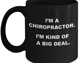 May include: Black coffee mug with white text that reads "I'm a Chiropractor. I'm kind of a big deal."